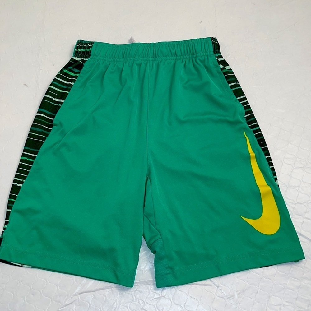 Nike green athletic shorts with yellow swoosh L